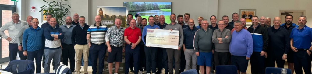 The Briggs Equipment National Accounts team and partners show cheque for £4,100 raised for Air Ambulances UK
