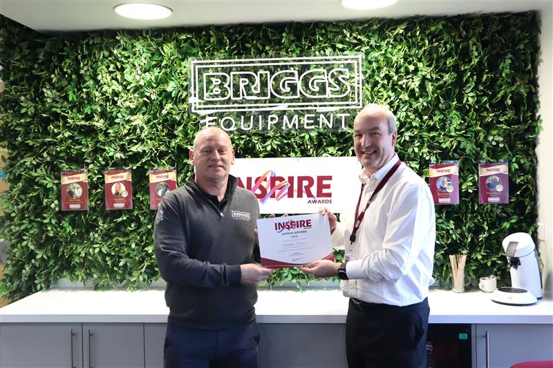 The 2024 Annual Inspire Award winner Andrew Hancox is presented with the award from Group Managing Director, Peter Jones.